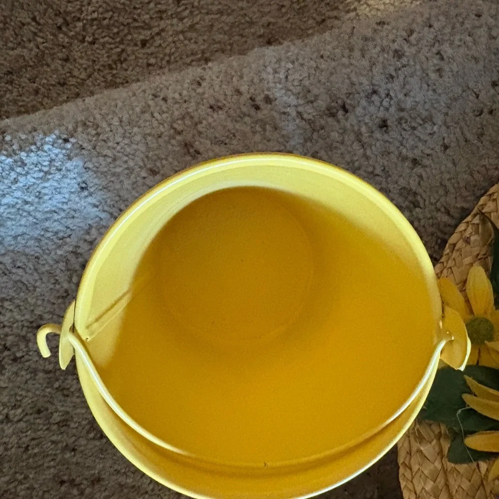 Pretty vintage sunflower straw hat with a sunflower bucket.